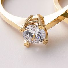 Solitaire Ring 10k 14k 18K Solid Gold/ Special Design Gold Engagement Ring For Her / Handmade Solitaire Fine Jewelry / A+ Cubic Zirconia / Nature Friendly Gift Package 💎 Stone Shape: Round 💎 Stone Cut: Brilliant 💎 Stone Color: DEF Grade 💎 Stone Clarity: VS1 - VVS 💎 Stone Size: 5mm A solitaire ring refers to any piece of jewelry with a single gemstone. A+ cubic zirconia solitaire rings have come to mark some of the most significant occasions in one's life, like sweet-sixteen, anniversaries, and the most notable, an engagement proposal. Traditionally, the solitaire symbolizes the commitment and fidelity between a couple. For this reason, it has become greatly associated with engagements and commitment rings. If you do want to incorporate a solitaire into your wedding  you may get it as Gold Moissanite Jewelry With Round Stone, Gift Ring With Single Diamond In Cubic Zirconia, Gold Jewelry With Tension Setting In Cubic Zirconia, Classic Gold Crystal Ring With Round Cut, Gold Cubic Zirconia Jewelry With Tension Setting, Classic Gold Crystal Ring As Gift, Elegant Gold Crystal Ring With Single Diamond, Elegant Yellow Gold Crystal Ring With Single Diamond, Classic Gold Plated Ring With Prong Setting