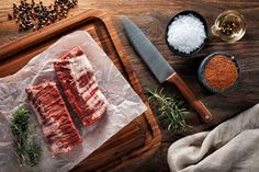 raw meat on cutting board with spices and seasoning