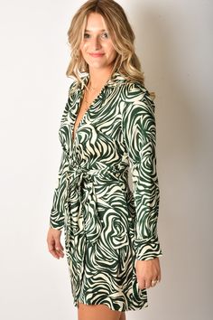 A retro botanical print wrap dress with a collared neckline and button sleeve Brand: KLD Content: 100% Polyester Size + Fit: Runs slightly big | Model is 5'7" Denim Sweater Jacket, Leather Puffer Jacket, Denim Sweater, Dress Store, Printed Wrap Dresses, Dress Satin, Beauty Store, New Arrival Dress, Tunic Dress