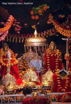 the shrine is decorated with flowers and garlands