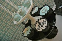 there are cupcakes that have been decorated with lace and pearls