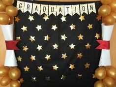 the graduation banner is decorated with gold stars