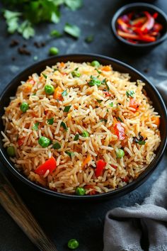 A bowl of vegetable fried rice with peas and red bell peppers. Rice Aesthetics, Delicious Rice Recipes, Savoury Rice Recipe, Tasty Rice Recipes, Herb Rice, Rice Dishes Recipes