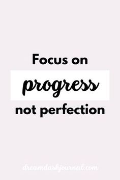 the words focus on progress not perfection are shown in black and white text, against a pink background