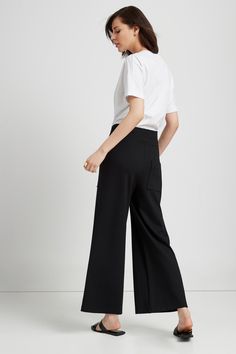 Relaxed. Versatile. Inspired by NYC life. You'll love our Nylah Pants. They're fashioned from structured, mid-stretch European ponte with a relaxed fit and a broad elasticized waistband. Two pockets line the front, another the back. Designed for those of us who like to keep it loose, these flowy, wide-legged pants will add polish to your look without sacrificing comfort. [SPLIT] Julia is 5'10" (178 cm) tall, wearing size XS. Total length from below the waistband is approximately 38" (96 cm). Ins Nyc Life, Black Pants, Wide Leg Pants, Winter Outfits, Casual Wear, Split, Wide Leg, Womens Sizes, Relaxed Fit