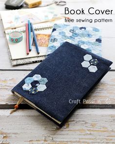 the book cover is made out of denim and has hexagons on it