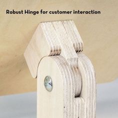 a close up of a wooden object with the words robot hinge for customer interaction