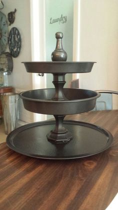 three tiered tray on top of a wooden table