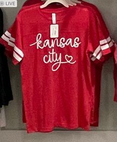 the kansas city shirt is hanging up in the closet