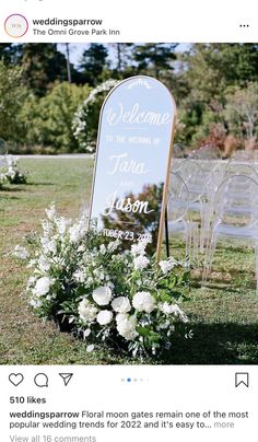 an outdoor ceremony with chairs and flowers on the grass, in front of a sign that reads welcome to the wedding of tara