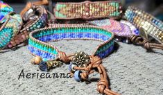 Bead Loom Leather Wrap Bracelet Blue Green Feather Blanket Boho Bracelet Bohemian Jewelry Aerieanna's Wristcraft This is a bead loom leather wrap bracelet made with naturally dyed (veggie) golden brown leather from the USA.  The beads are shades of green and blue. The button is brass plated pewter in a beaded flower design. Glass and stone dangles with feather charm. This bracelet closes at about 7 1/4" and 8 1/4". Bohemian Adjustable Leather Bracelet For Festival, Adjustable Bohemian Leather Bracelet For Festival, Bohemian Adjustable Leather Bracelet With Colorful Beads, Adjustable Bohemian Leather Bracelet With Colorful Beads, Handmade Adjustable Bohemian Leather Bracelet, Adjustable Bohemian Leather Bracelet, Bohemian Leather Bracelet With Colorful Beads For Festivals, Adjustable Turquoise Leather Bohemian Bracelet, Adjustable Hippie Leather Bracelet For Festivals