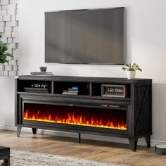 an entertainment center with a television and fire in it