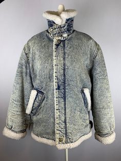 "Vintage 80's Sone Washed Denim Sherpa Jacket  Label size Medium  Fits men's size medium Made In Italy by Forenza 100% cotton  Machine washable  Zipper front  Adjustable waist straps Pockets  Neck/Collar straps Fully Lined Great condition.  25-1/2\" across the chest  20-1/2\" shoulder to shoulder seam  25\" shoulder seam to cuff  30-1/2\" from collar fold to hem" Vintage Faded Stonewashed Denim Jacket, Denim Sherpa Jacket, Retro Pre-washed Denim Outerwear, Vintage Blue Pre-washed Outerwear, Vintage Pre-washed Medium Wash Denim Jacket, Vintage Indigo Pre-washed Outerwear, Pleated Skirt Dress, Sherpa Jacket, Washed Denim