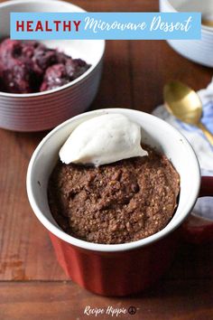 a close up of a bowl of food with ice cream on top and the words gluten free grain free low sugar microwave dessert cherry mug cake