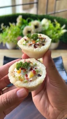 two small food items being held in their hands