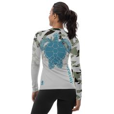 a women's long sleeve shirt with a turtle on the chest and camouflage print