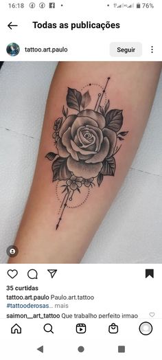 a black and white rose tattoo on the arm