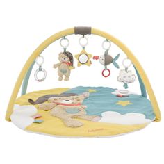 a baby's play mat with toys hanging from it