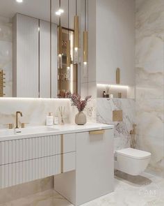 a white bathroom with gold accents and marble walls