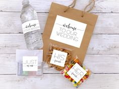 the wedding gift bag is filled with treats and water bottles for guests to take home