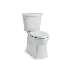 a white toilet sitting on top of a white floor