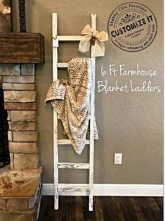 an old ladder is used as a towel rack