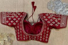 Stunning maroon heavy embroidery designer blouse. Buy designer blouse in USA from Pure Elegance. Disclaimer: The actual product may vary slightly from the image. These are custom orders, hence expect slight variation in color, placement of the motif or buta. ESTIMATED DELIVERYBecause this is a custom order, it would take about 4 weeks from the date of purchase. RETURN POLICY: This product is a custom order and cannot be returned or exchanged. Corset Blouse, Readymade Saree, Sari Blouse, Fashion Journals, Traditional Fabric, Blouse Online, Saree Styles, Saree Blouse Designs, Blouse Dress