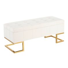 a white bench with gold legs and a foot rest on the bottom one end is upholstered