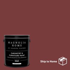 a red paint can with the words magnolia home painted on it and an image of a house