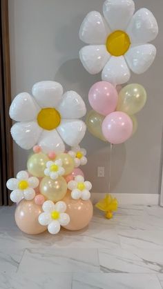 some balloons and flowers are on the floor