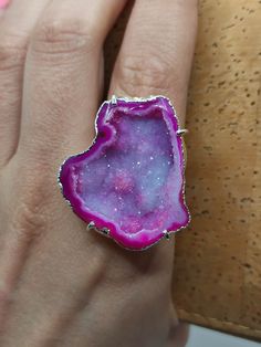 Introducing our stunning Geode Rings - nature's hidden treasures transformed into exquisite jewelry! Each Geode Ring showcases the unique beauty of geodes, with their captivating crystals and vibrant colors. Elevate your style and connect with the Earth's natural wonders. Discover the magic of geodes with our Geode Rings today! 🔸Adjustable band ring  🔸30mm stone size 🔸Color may vary according to lighting 🔸Silver filled We offer  🔸Fast shipping  🔸Free shipping eligible orders 🔸Polishing cl Agate Open Ring Jewelry, Agate Gemstone Open Ring Jewelry, Unique Round Gemstone Geodes, Agate Gemstone Open Ring, Unique Crystal Open Ring With Stone Setting, Agate Jewelry With Natural Stones In Open Ring Shape, Agate Ring With Large Stone, Unique Agate Crystal Ring Gift, Unique Agate Crystal Ring For Gift