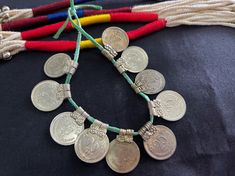 These extremely beautiful ethnic looking 25 paise coins are old looking Indian banjara metal charms for your ethnic jewelry. They are silver in color and very light in weight. They're approx. 19 mm in diameter and it's length is 23 mm approx. You will receive a set of 10 pieces. Traditional Handmade Coin Necklace, Traditional Coin Pendant Necklace For Festivals, Bohemian Coin Necklace For Festivals, Scrapbook Embellishments Diy, Cowry Shell, Embellishment Diy, Metal Charms, Ethnic Earrings, Coin Jewelry