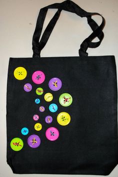 a black bag with colorful buttons on it