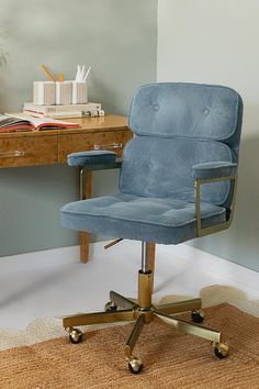 a blue office chair sitting on top of a rug