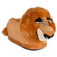 a close up of a stuffed animal on a slipper with big eyes and nose