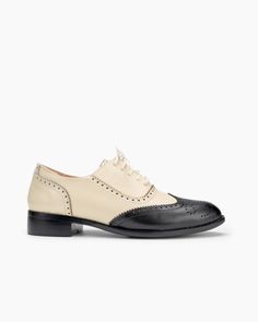 Elevate your footwear collection with the Lace Up Two Tone Flat Brogues Wingtip Oxford. Combining classic brogue details with a contemporary two-tone design, these shoes are perfect for anyone seeking to make a stylish statement while enjoying all-day comfort. Product Details h2 { text-align: center; margin-bottom: 20px; } .tab-container { display: flex; border-bottom: 2px solid #ddd; margin-bottom: 20px; } .tab { flex: 1; text-align: center; padding: 10px; cursor: pointer; font-weight: bold; bo Chic Wingtip Oxfords With Brogue Detailing, Classic Cap Toe Flats For Work, Vintage Flat Heel Oxfords For Office, Classic Spring Cap Toe Flats, Elegant Cap Toe Lace-up Shoes For Spring, Elegant Spring Cap Toe Lace-up Shoes, Elegant Spring Lace-up Cap Toe Shoes, Flat Heel Oxfords With Brogue Detailing, Spring Cap Toe Leather Shoes With Rubber Sole