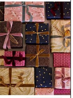 many wrapped presents with bows and ribbons