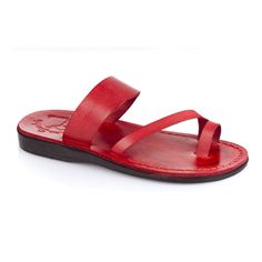 a pair of red sandals on white background