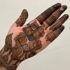 the hand is decorated with intricate designs