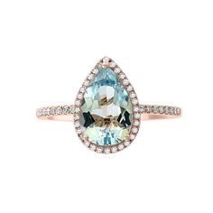 an aqua and white topazte ring with diamonds on the band, set in rose gold