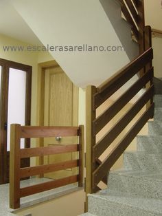 the stairs are made out of wood and marble