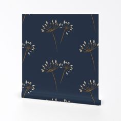 a blue wallpaper with white flowers and gold foil on the bottom, against a dark background