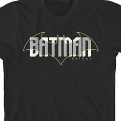 Look as cool and confident as your favorite superhero in this awesome Batman tee! This fun t-shirt showcases a large layered graphic of a bat symbol with Batman's name in bold white letters overlapping it. This comfy shirt is made of a high-quality cotton, and is professionally printed to ensure long-lasting color and print quality. It can be machine washed in cold water with like colors, and tumble dried on low for easy and convenient care. The Batman Emblem Overlapping Youth Boy's Black T-Shir Batman Name, Batman Emblem, Batman Tshirt, Bat Symbol, The Batman, Comfy Shirts, Black Man, White Letters, Toddler Boys