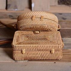 This woven rattan crossbody handbag is unique and chic. The shoulder straps are made of leather, adding a touch of luxury, and the bag itself is intricately woven to create a one-of-a-kind look. It's perfect for carrying all your essentials while adding a touch of nature to your outfit. 100% Handcrafted, Natural, Unique, and Chic. Leather shoulder straps length: 60" Size: 7.5" L x 5" H x 3" W Bohemian Straw Shoulder Bag With Woven Leather, Chic Rattan Shoulder Bag With Adjustable Strap, Natural Straw Crossbody Bag With Bamboo Handle, Natural Crossbody Shoulder Bag With Bamboo Handle, Rectangular Rattan Shoulder Bag With Open Weave, Basket-shaped Rattan Shoulder Bag With Woven Leather, Rectangular Rattan Bag With Open Weave, Rectangular Woven Rattan Shoulder Bag, Rectangular Open Weave Rattan Bag