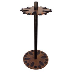 a wooden stand with two black and brown designs on it