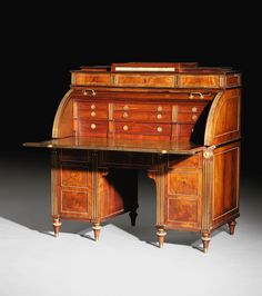 an antique wooden desk with two drawers