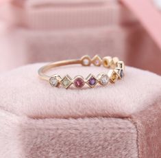 Rainbow Sapphire Eternity Band, Colorful Natural Gemstone Rings, Multi Colored Stone Rings, Stackable Mothers Ring, Birthstone Stacking Ring ✧･ﾟ: *✧･ﾟ:* Welcome to Charles Davin Jewelry*:･ﾟ･ﾟ✧ Moissanite - a gemstone known to bring in luck in someone's life, the user can give off a look of elegance. You can give your special someone luck whilst showing your love to them. ✶Material: 10K/ 14K/ 18K ✶Main Stone: Natural Sapphires and Natural Gemstones ✶Side Stone: - ✶Width of band: 1.3mm ✶Thickness Elegant Adjustable Rainbow Rings, Multicolor Round Diamond Wedding Ring, Multicolor Diamond Wedding Ring, Adjustable Multicolor Birthstone Rings, Multicolor Cubic Zirconia Crystal Ring For Weddings, Multicolor Multi-stone Stackable Fine Jewelry Rings, Elegant Multicolor Stackable Birthstone Rings, Multicolor Stackable Cubic Zirconia Jewelry, Multicolor Multi-stone Stackable Rings In Fine Jewelry Style