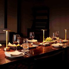 a long table with plates and glasses on it