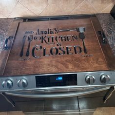 a kitchen is closed sign on an oven