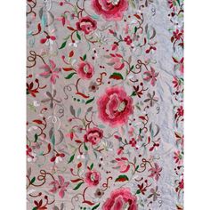 the fabric has pink flowers and green leaves on it, along with silver sequins